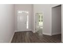 Bright entryway with wood-look floors and access to other rooms at 100 Lemon Drop Ln, Franklinton, NC 27525