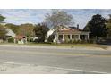 Two-story house with front porch, visible from across the road at 715 E Broad St, Fuquay Varina, NC 27526