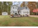 Two-story house with a large backyard and detached shed at 143 Rawhide Dr, Louisburg, NC 27549