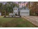 Two-story house with deck and beautifully landscaped yard at 143 Rawhide Dr, Louisburg, NC 27549