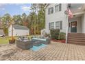 Brick patio with comfortable outdoor seating area at 143 Rawhide Dr, Louisburg, NC 27549