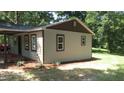 Side view of the house showcasing exterior at 24 Mae Turners Dr, Goldston, NC 27252