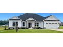 Craftsman style home with white siding and gray roof at 110 Lemon Drop Ln, Franklinton, NC 27525