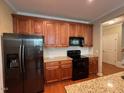 Spacious kitchen with granite countertops and stainless steel appliances at 3318 Denada Path, Durham, NC 27707