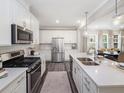 Modern kitchen with stainless steel appliances and island at 516 Hester Rd, Durham, NC 27703