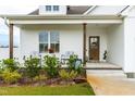 Front porch with rocking chairs and landscaping at 181 Glenwood Pl, Kenly, NC 27542
