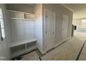 Bright entryway with built-in bench, shelving, and coat closets at 95 Mapledale Ct, Benson, NC 27504