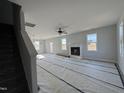 Spacious living room with a fireplace and large windows at 95 Mapledale Ct, Benson, NC 27504