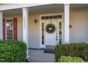 Front door entrance with a Christmas wreath at 2513 Pepperstone Dr, Graham, NC 27253