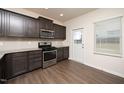 Modern kitchen with stainless steel appliances and granite countertops at 2117 Attend Xing, Fuquay Varina, NC 27526