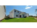 Rear view of a two-story home showcasing a patio and backyard at 1071 Cherry Stem Rd, Haw River, NC 27258