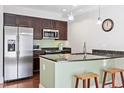 Modern kitchen with stainless steel appliances and granite countertops at 222 Glenwood # 602, Raleigh, NC 27603