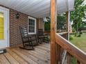 Relaxing front porch with rocking chairs, perfect for enjoying the outdoors at 178 Paceville Rd, Selma, NC 27576