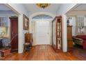 Bright entryway with hardwood floors and vintage furniture at 107 N Clark St, Henderson, NC 27536