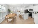 Kitchen with breakfast bar and adjacent dining area at 2864 Huxley Way, Apex, NC 27502