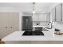 Modern kitchen with stainless steel appliances and quartz countertops at 1917 Washington St, Durham, NC 27704