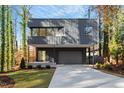 Contemporary house with sleek design and two-car garage at 1208 Wimbleton Dr, Raleigh, NC 27609