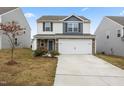 Two-story home with stone accents and a two-car garage at 737 Crackling Ct, Zebulon, NC 27597