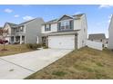 Two-story home with stone accents and a two-car garage at 737 Crackling Ct, Zebulon, NC 27597