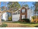 Two-story home with a brick and siding exterior at 104 Full Moon Ct, Garner, NC 27529