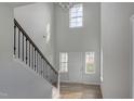 Bright entryway with hardwood floors, staircase, and large windows at 2802 Lacy Holt Rd, Graham, NC 27253