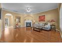 Hardwood floors, fireplace, and large windows in living room at 1962 Glenkirk Dr, Burlington, NC 27215