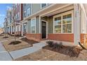Inviting townhouse entrance with brick accents at 129 Pearl St # 6, Garner, NC 27529