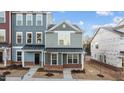 Newly built townhouse exterior with brick and siding at 129 Pearl St # 6, Garner, NC 27529
