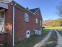 Side view of brick ranch house at 2222 Sunset Hills Dr, Burlington, NC 27215