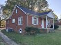 Brick ranch house with a covered porch, side view at 2222 Sunset Hills Dr, Burlington, NC 27215