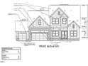 Front elevation of a two-story home with two-car garage at 4332 Coldwater Springs Dr, Raleigh, NC 27616