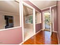 Entryway with wood flooring and a view into the living room at 1 Westbury Pl, Durham, NC 27707