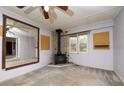 Living room with corner fireplace and large mirror at 1 Westbury Pl, Durham, NC 27707