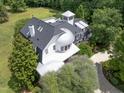 An aerial view showcasing a unique home's architecture and landscaping at 1153 Four Wheel Dr, Wake Forest, NC 27587