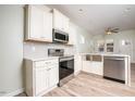 Modern kitchen featuring stainless steel appliances and white cabinets at 831 Ridgeway Ave, Durham, NC 27701