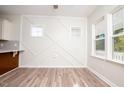 Bright breakfast nook with an accent wall and wood flooring at 831 Ridgeway Ave, Durham, NC 27701