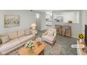 Virtually staged living room with open concept and kitchen view at 1122 E Ellerbee St, Durham, NC 27704