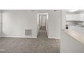 Bright hallway with access to bedrooms and kitchen at 1122 E Ellerbee St, Durham, NC 27704