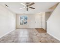 Bright living room with tile floors and access to stairs at 2129 Ventana Ln, Raleigh, NC 27604