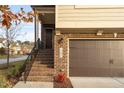 Side view of tan and brown brick townhome at 1203 Lotus Lilly Dr, Durham, NC 27713