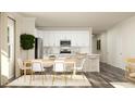 Modern eat-in kitchen with white cabinets and an island at 0 Hanover Dr, Sanford, NC 27330