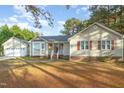 Ranch house with attached garage and landscaping at 1609 Quail Grove St, Willow Springs, NC 27592