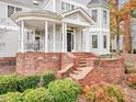 Brick staircase leading to a charming front porch at 206 Arbor Dr, Elon, NC 27244