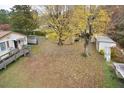 Large backyard with mature trees and a storage shed at 124 Jack Bennett Rd, Chapel Hill, NC 27517
