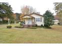 House exterior featuring a front porch and well-maintained lawn at 124 Jack Bennett Rd, Chapel Hill, NC 27517