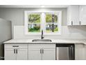 Modern kitchen sink and countertops with granite and white cabinets at 509 Keith St, Knightdale, NC 27545