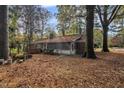 Back of house showing a screened porch and yard at 910 Parham St, Henderson, NC 27536