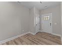 Bright foyer with light gray walls and wood-look flooring at 121 Pearl St # 4, Garner, NC 27529