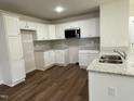 Modern kitchen with white cabinets and granite countertops at 131 Tulipfield Way, Benson, NC 27504