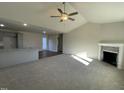 Spacious living room with high ceilings, fireplace, and hardwood floors at 396 Magnolia Run Way, Benson, NC 27504